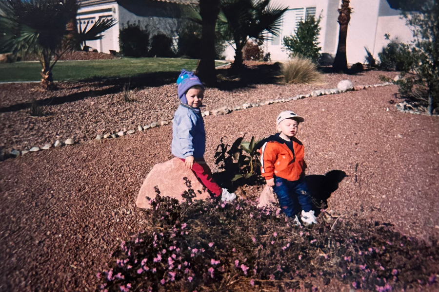 Little girl and little boy playing outside