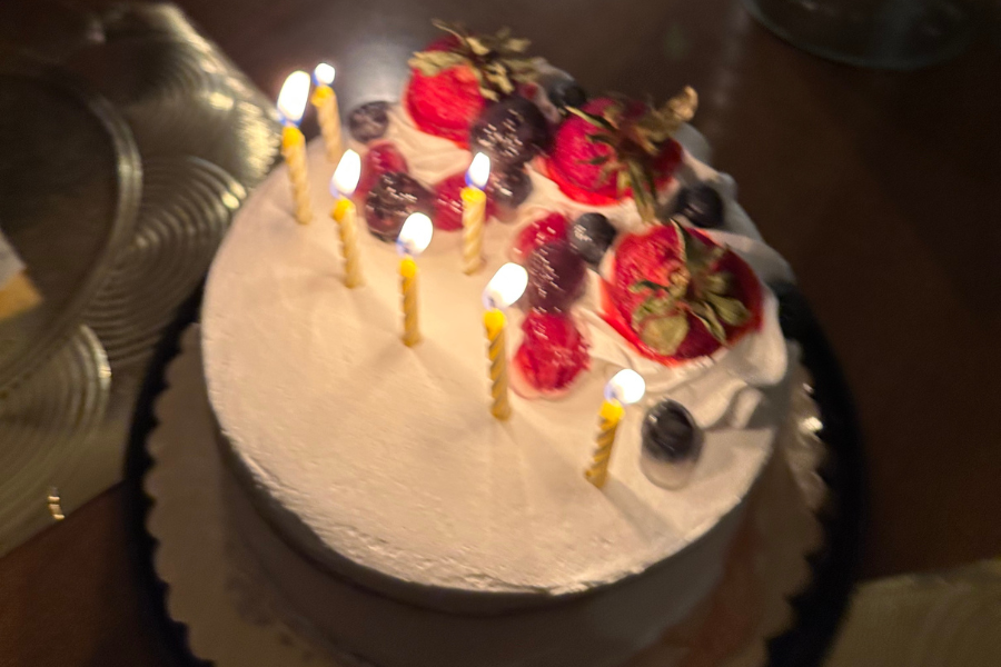 a birthday cake with candles lit, growing pains 