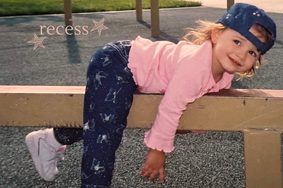 little girl playing on a playground, recess