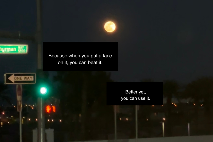 full moon on street with light and stop sign, with text overtop