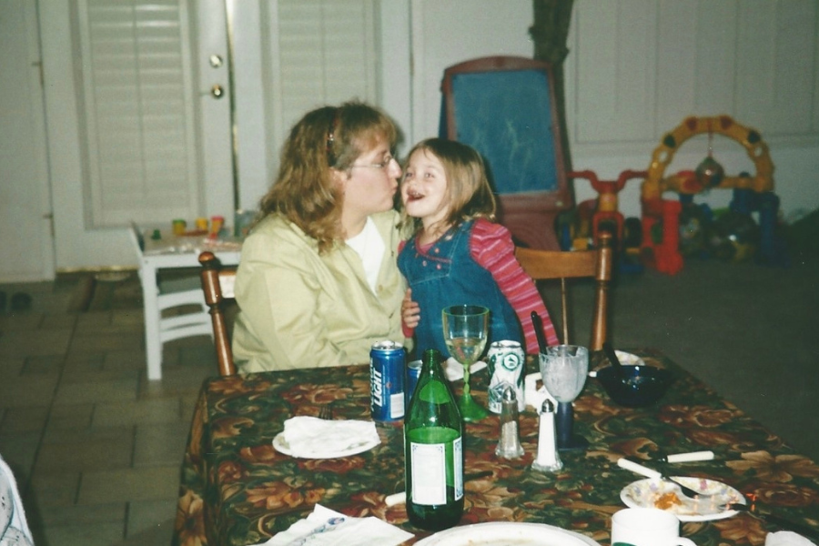 mother and daughter kissing 