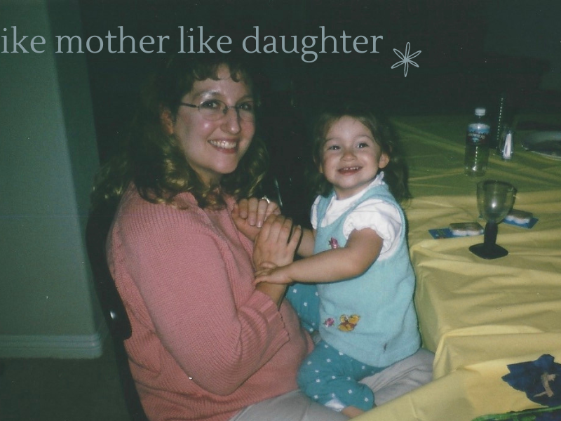 a mother and daughter sitting at a table