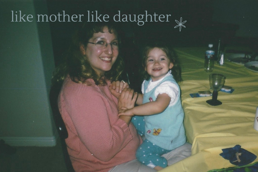 a mother and daughter sitting at a table