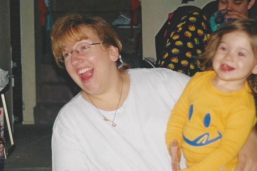 mother and daughter smiling and laughing