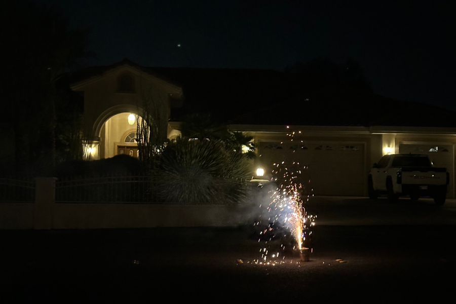 firework exploding on street at night